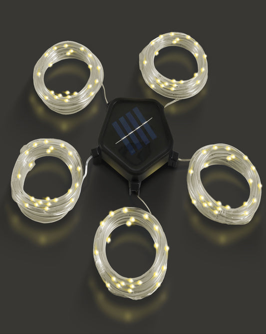 Solar-powered LED string lights on a dark background