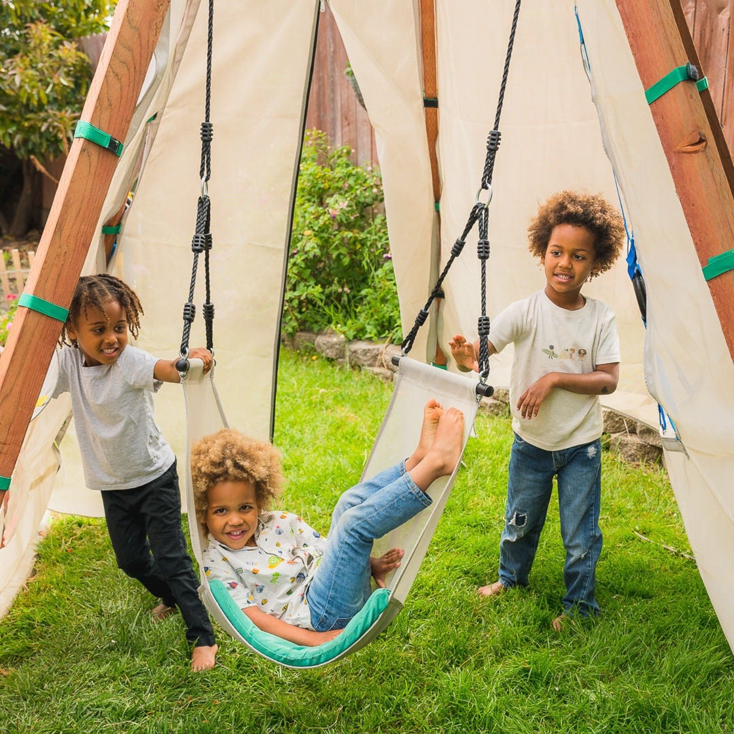 Three children playing with a Bijou Nest