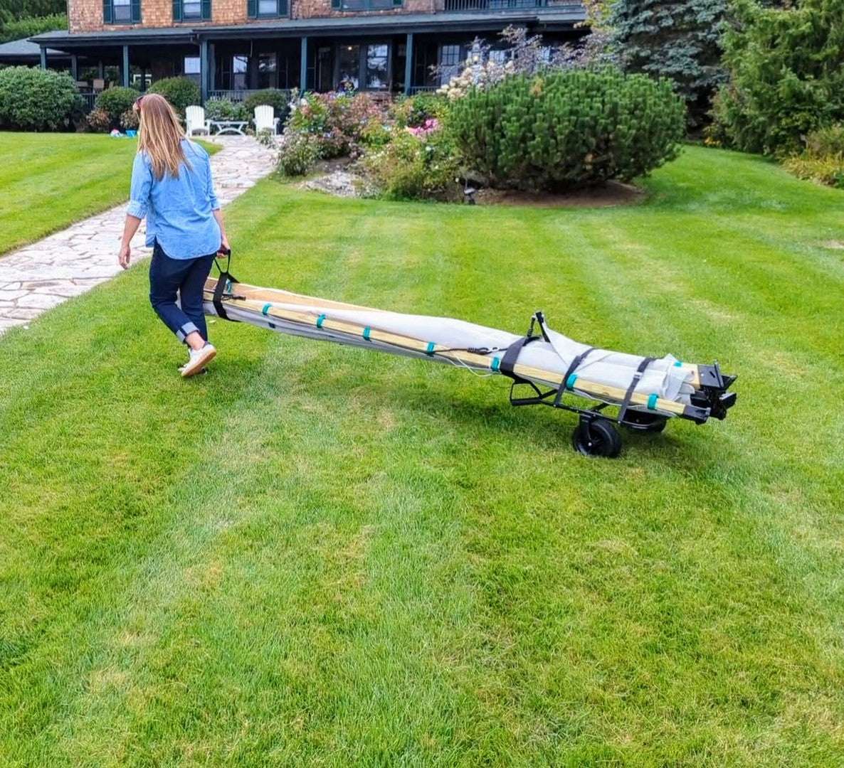 A woman using the Bijou roller to transport a Bijou playset