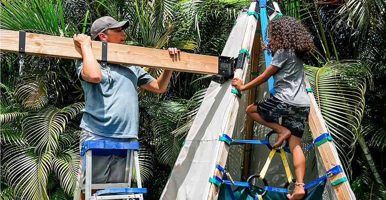Child climbing on a Bijou Build play structure