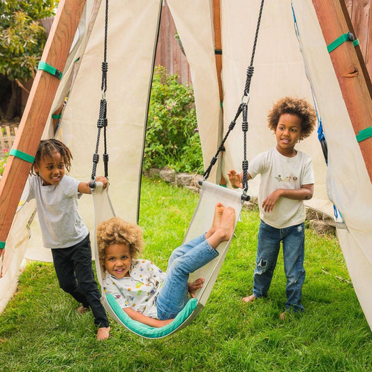 Three children playing with a Bijou Nest