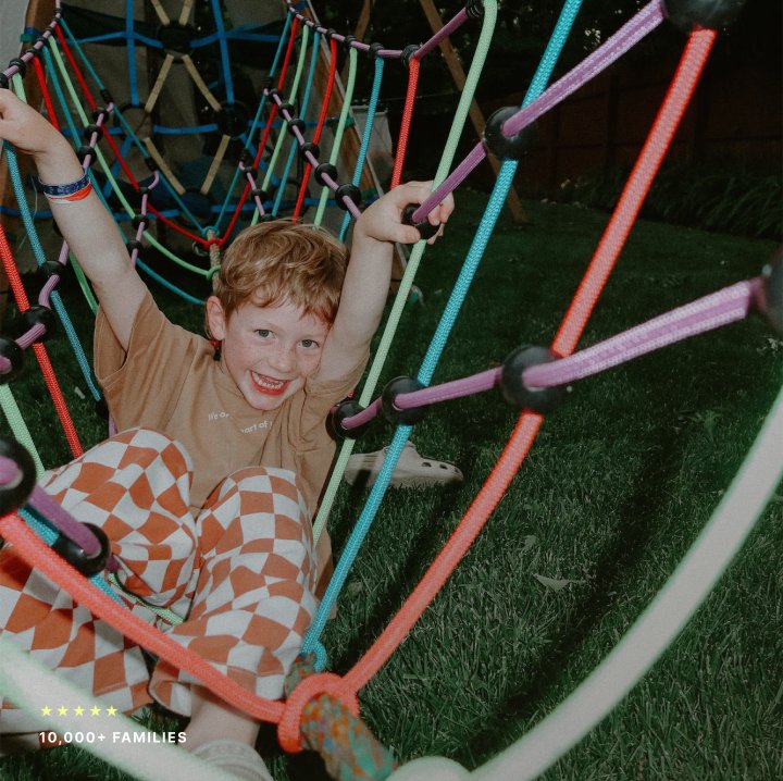 Child climbing on a Bijou Build play structure
